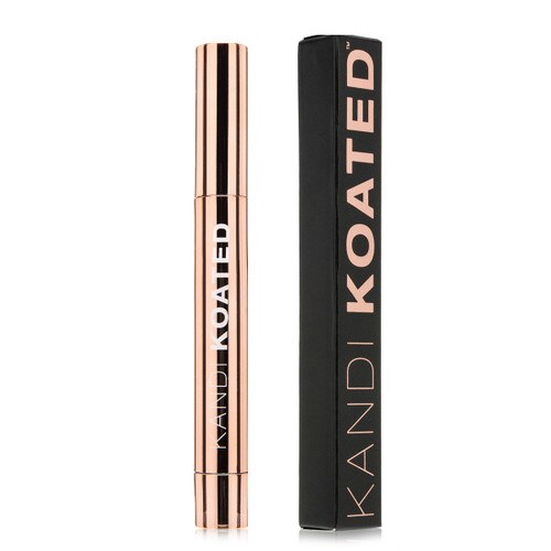 A tall thin closed cylindrical tube of Finesse concealer next to its black and rose gold box. Both stand upright on a white background.